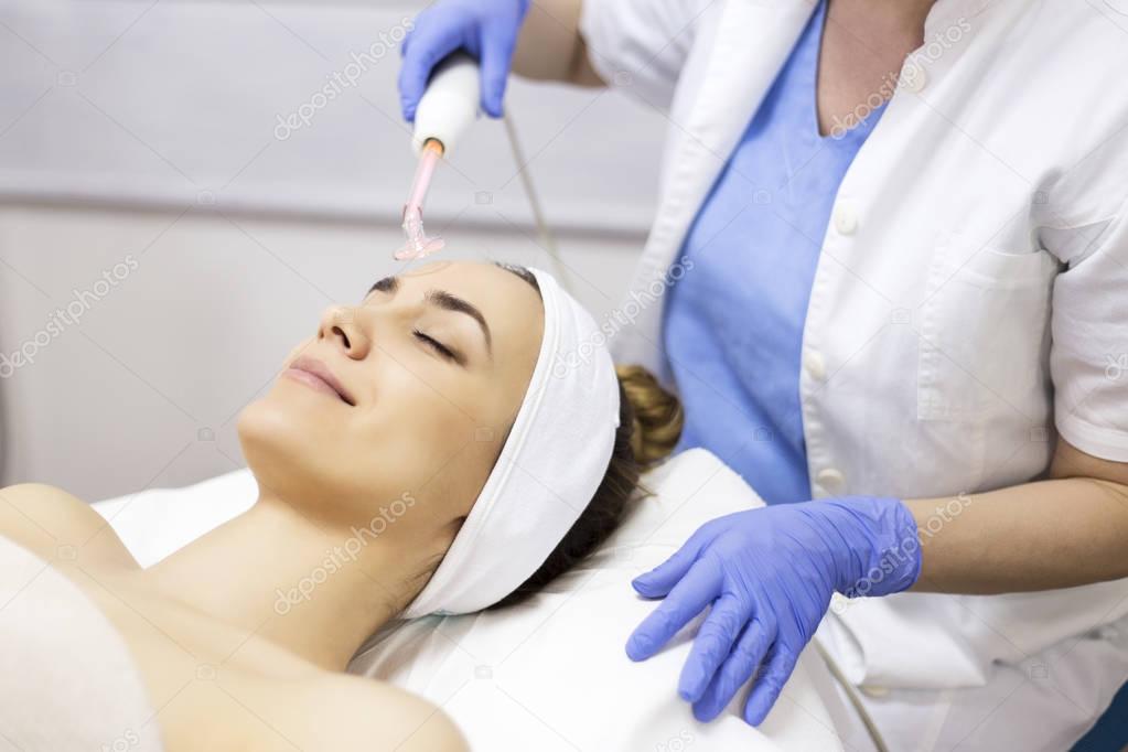 woman receiving facial beauty treatment