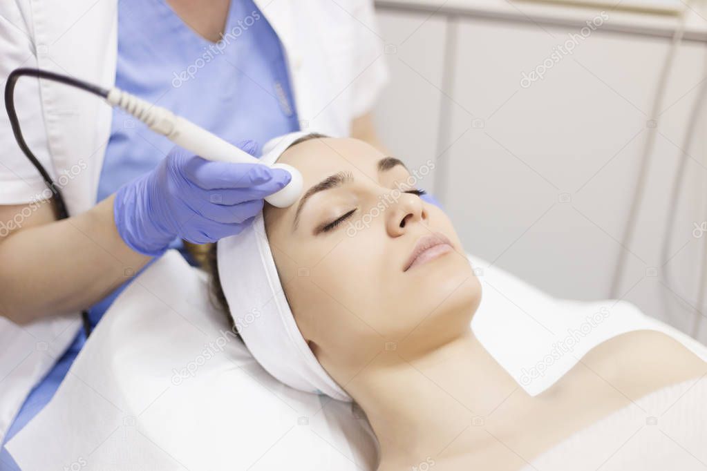 woman receiving facial beauty treatment