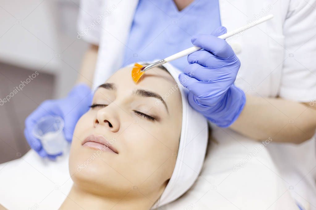 Facial peeling mask applying