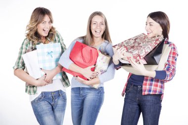 happy women smiling with shopping bags