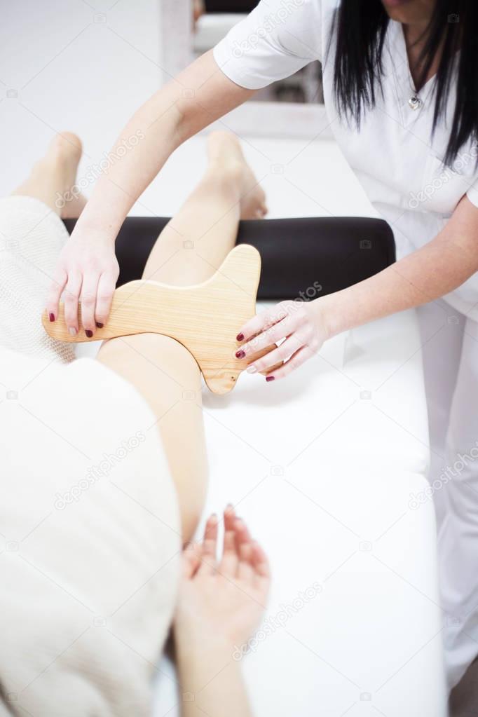 Anti cellulite massage for woman with rolling pins