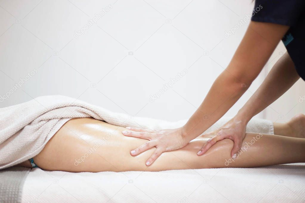 Anti cellulite massage for woman in beauty salon