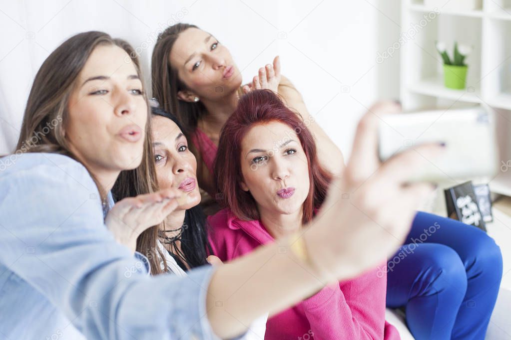 women having fun and taking selfie