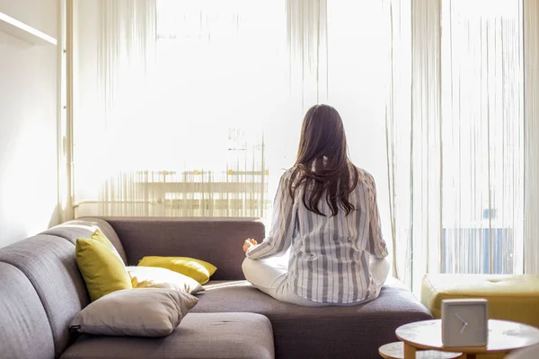 Young woman at home doing Yoga — Stock Photo, Image