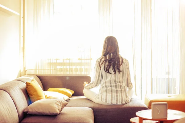 Young woman at home doing Yoga — Stock Photo, Image