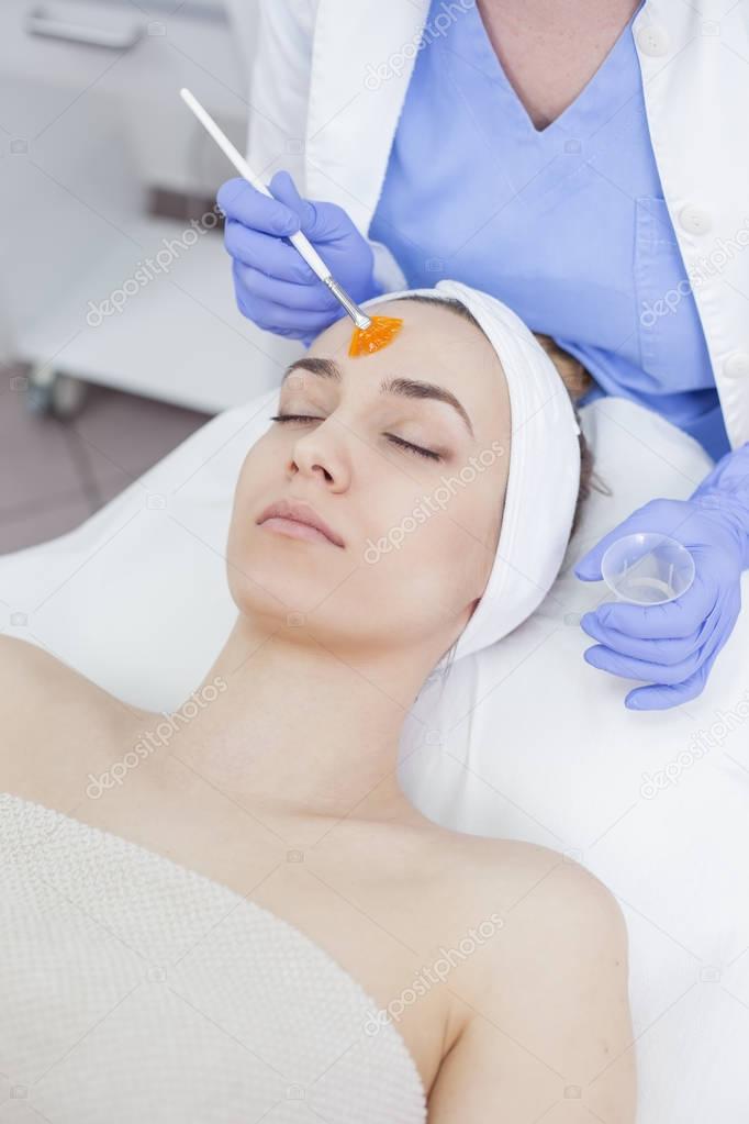 woman in the beauty salon on the face treatment