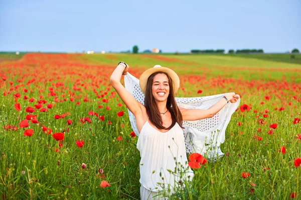 Woman in the field of red poppies — Stock Photo, Image