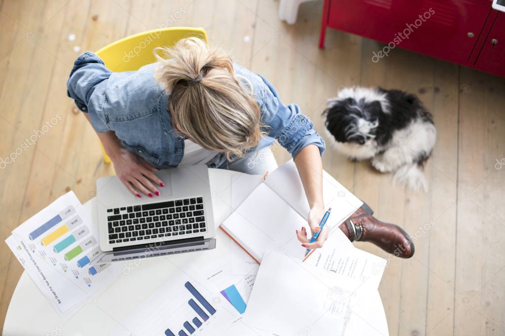 woman works on computer from a home