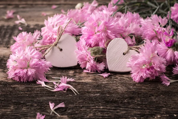 Fresh spring flowers on wooden vintage table — Stock Photo, Image