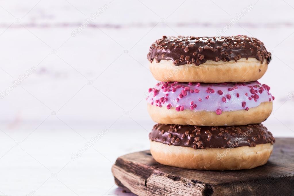 Donut. Sweet icing sugar food. Dessert colorful snack. Glazed sprinkles.