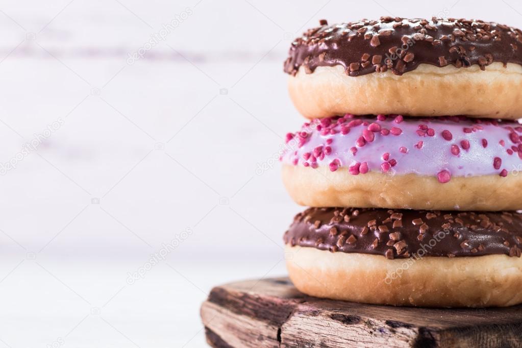 Donut. Sweet icing sugar food. Dessert colorful snack. Glazed sprinkles.