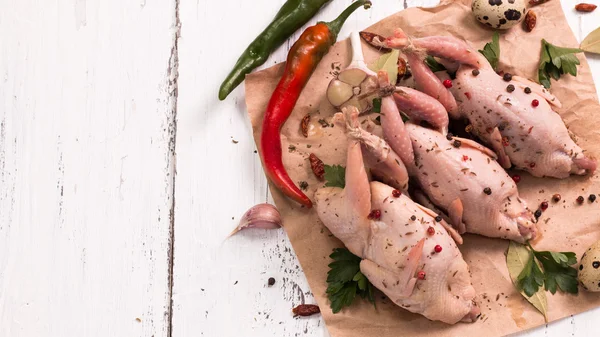 Fresh organic quails on vintage wooden table, healthy food — Stock Photo, Image