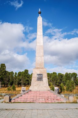 Altai Republic, Russia - September, 12, 2019: Monument in honor of the 200th anniversary of the Altai people joining Russia, 1756-1956. Obelisk on Seminskiy mountain path