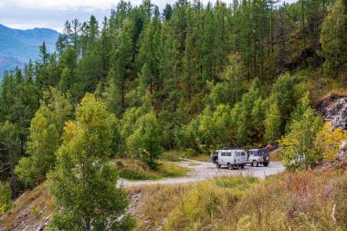 Chike-Taman Pass, Altai Mountains, Russia - September, 13, 2019: UAZ off-road vehicles at the observation deck