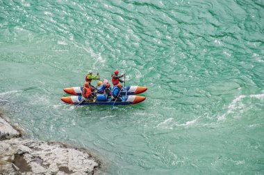 River Katun, Altai Republic, Russia - September 13, 2019: tourists-rafters rafting on mountain river