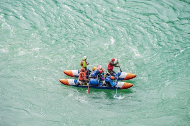 River Katun, Altai Republic, Russia - September 13, 2019: tourists-rafters rafting on mountain river