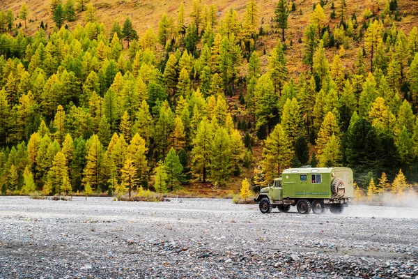 ZIL-131 off-road truck driving off-road. Aktru River Valley, Altai Mountains, Russia