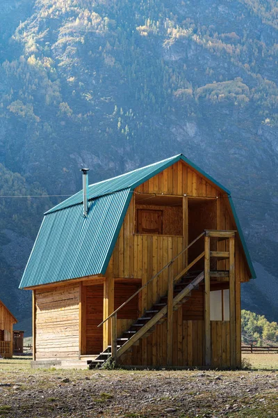 Wooden guest house in a tourist camp in a mountain valley. Russia, the Republic of Altai, tract Akkurum