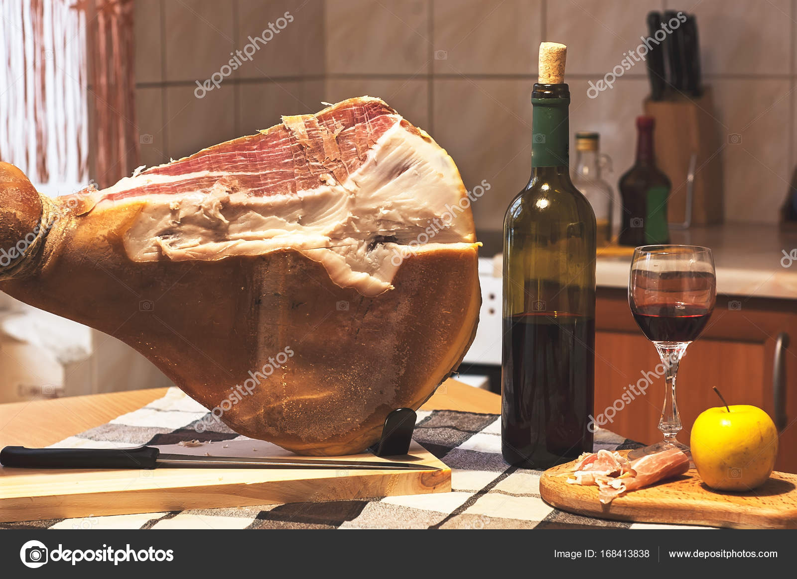 Spanish Jamon Serrano, tabla jamonera, jamonero knife with glass and bottle  of wine. Food photo concept Stock Photo by ©siteburo 168413838
