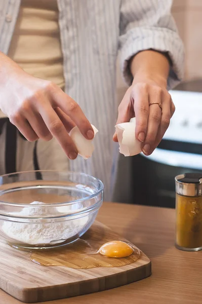 Kitchen disaster, bad cooking : spilled eggs and confused woman