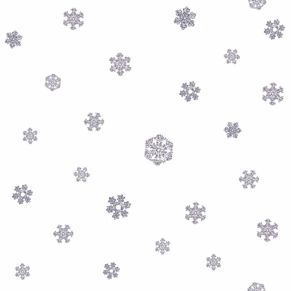 Struttura senza giunture di diversi fiocchi di neve su sfondo bianco — Foto Stock