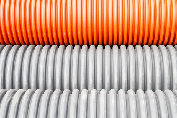 Construction tuyaux en plastique orange et noir — Photo