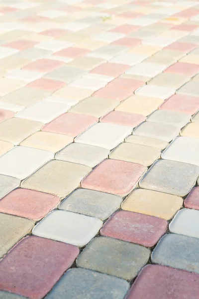 Stenbeläggningen plattor i form av färgglada klossar — Stockfoto
