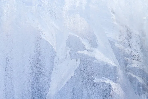 Winter frosty patterns on the frozen ice window — Stock Photo, Image