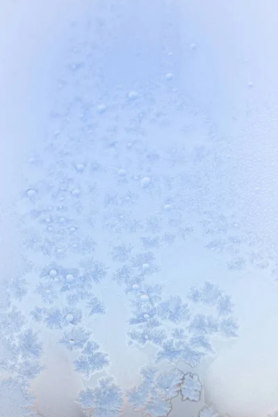 Winter frosty patterns on the frozen ice window — Stock Photo, Image