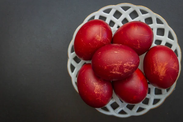 Dyed eggs in onion skins are at the plate