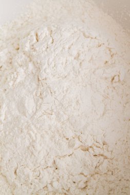 Cooking dough in a white plastic bowl at home