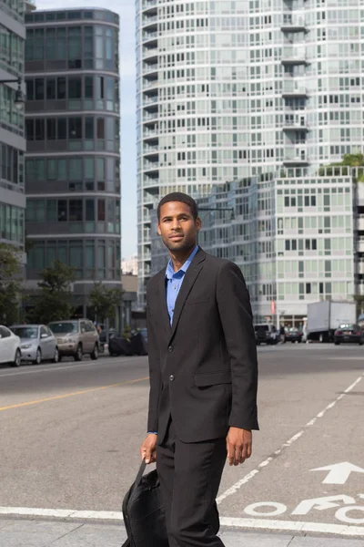 Vertical shot of young African American man in business suits, l