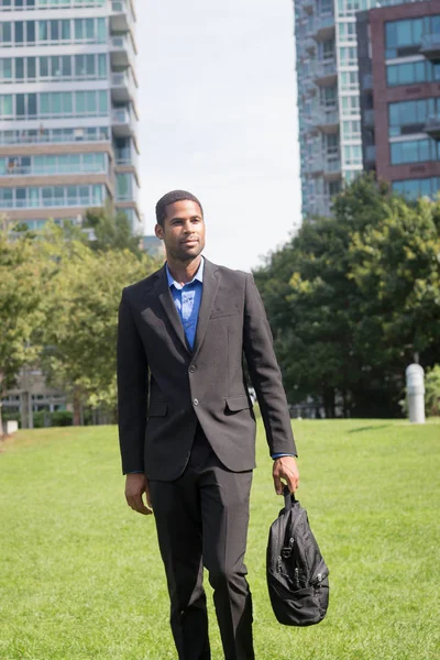 Good looking young African American business man in suits, commu — Stock Photo, Image