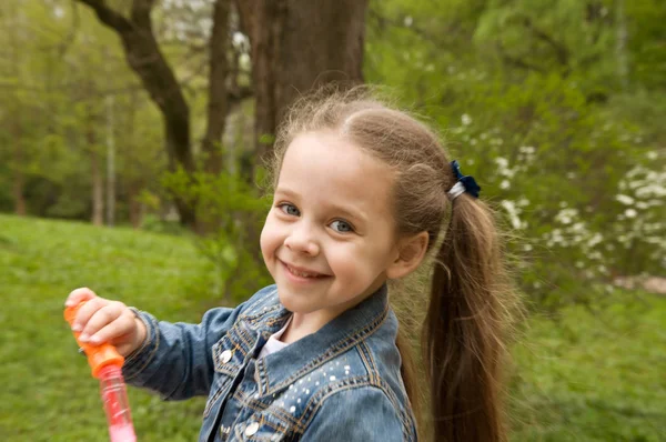 Little girl having fun in the park — Stock Photo, Image