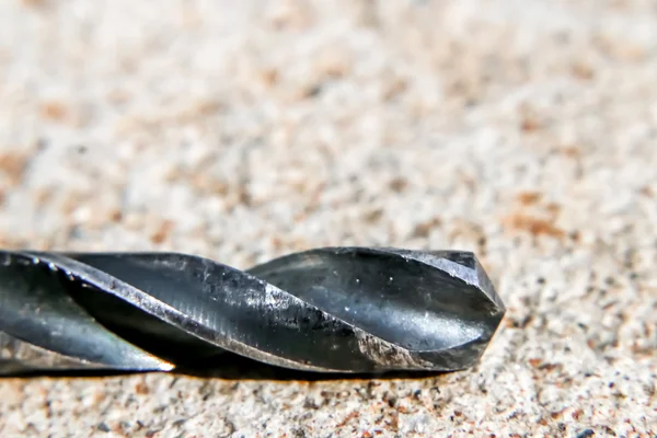 The Isolated Drill Bits with the Gray Ground Background