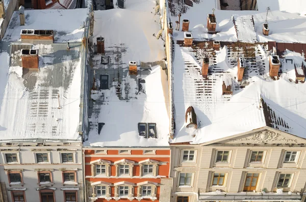 Kış kar, Ukraine.Lviv veya Lvov, Doğu Ukrayna - city hall Saat Kulesi şehrin görünümünü kapsadığı Lviv Panoraması.