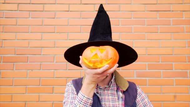 Young man with Jack latern pumpkin — Stock Video