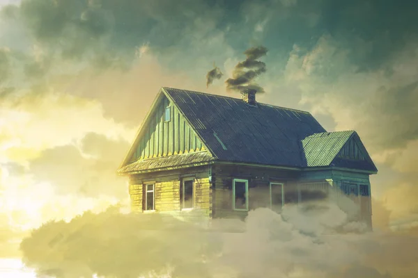 The house in the clouds hovering above the ground — Stock Photo, Image