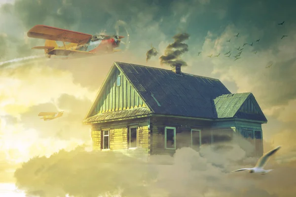The house in the clouds hovering above the ground — Stock Photo, Image