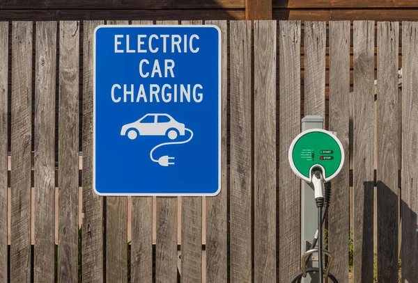 Electric car charging station road sign