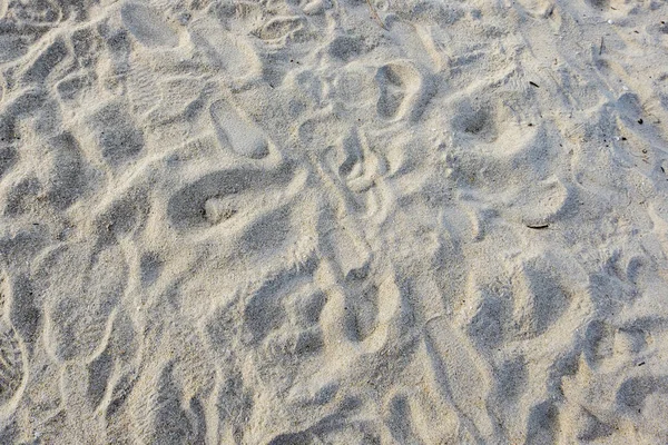 White sandy beach texture background with foot print — Stock Photo, Image