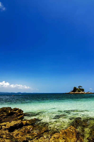 Hidden beauty of Kapas Island located in Terenganu, Malaysia at sunny day. blue sky and clear sea water.