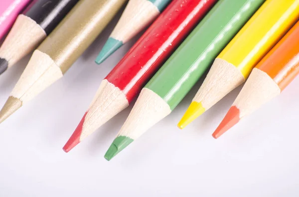 Colorful color pencil stacked on white background ideal for back-to-school and education concept — Stock Photo, Image