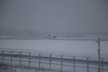 Airplane in hard weather.