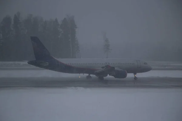 Airplane in hard weather.