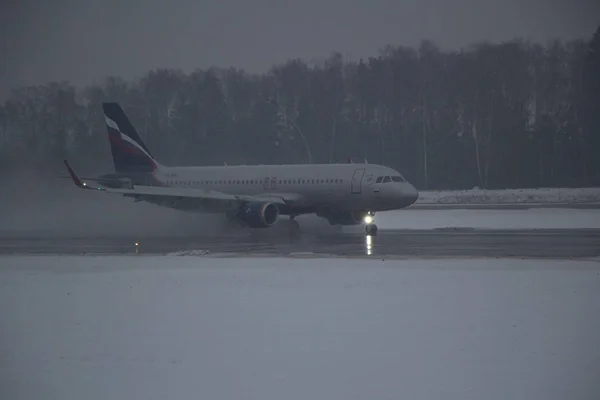Airplane in hard weather. — Stok fotoğraf