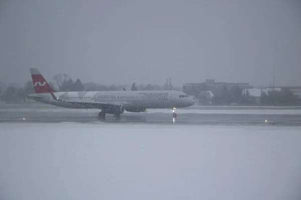 Airplane in hard weather.