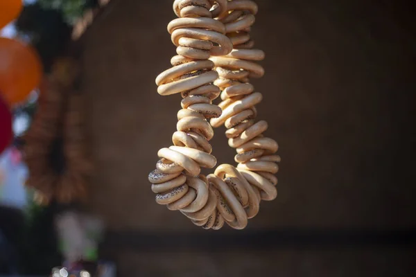 Bagels whist on a rope. — Stock Photo, Image