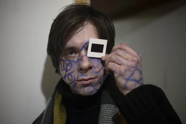 A guy with patterns on his face.