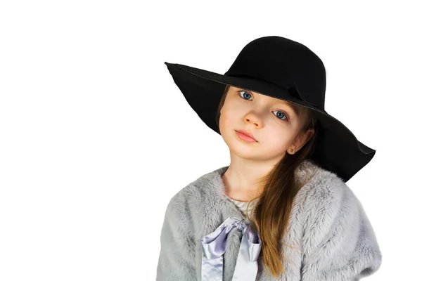 Menina segurando chapéu e olhos grandes — Fotografia de Stock